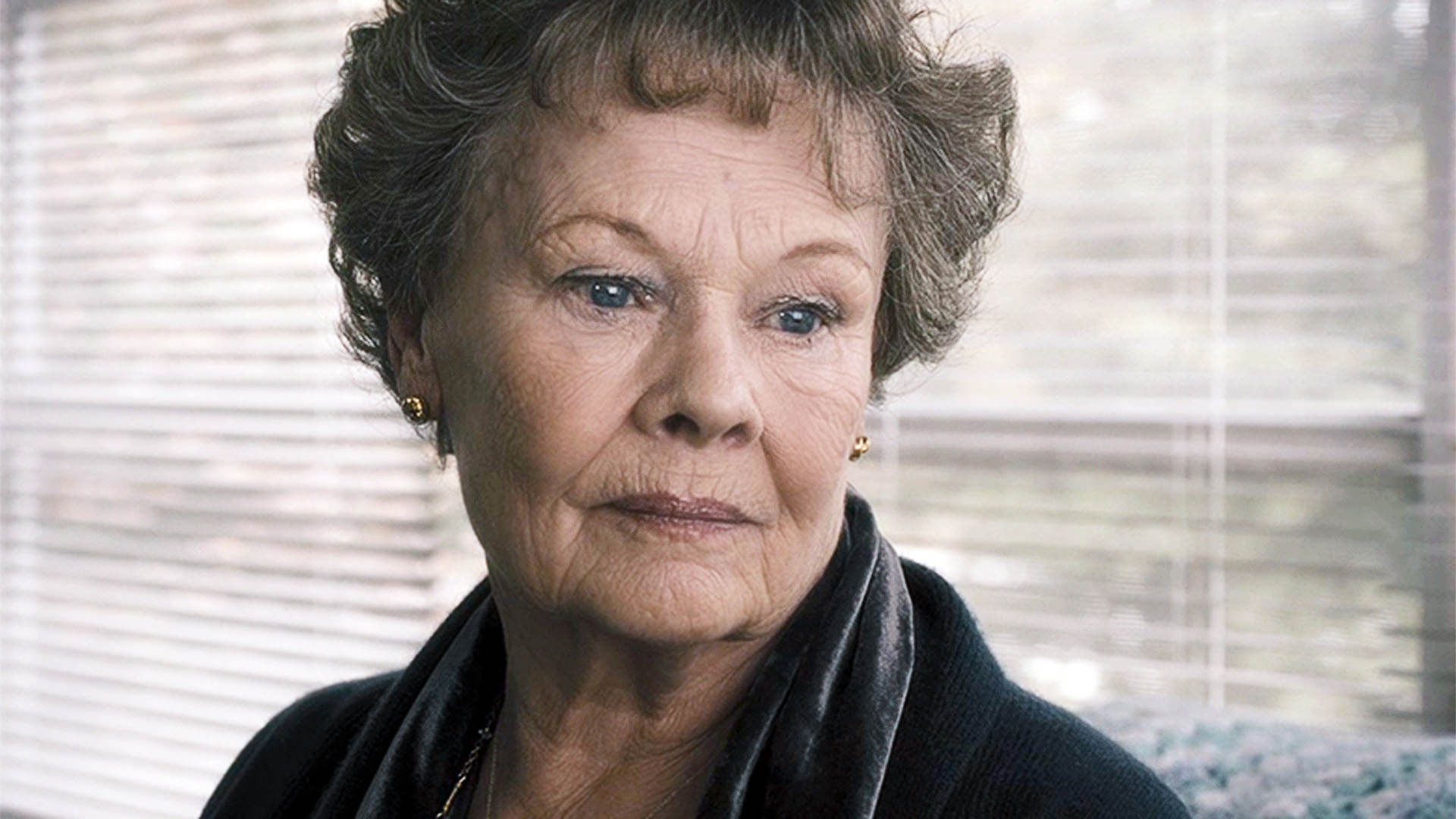 Judi Dench looking emotional